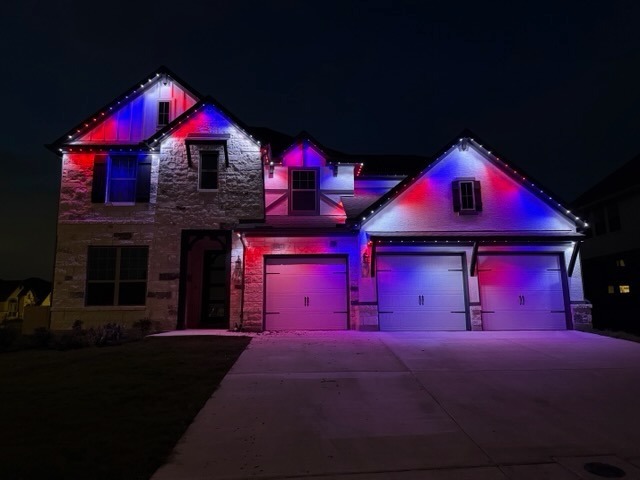 Texas Hill Country home with red, white, and blue Independence Day LED lighting